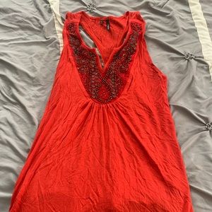 Maurice’s red racer back tank